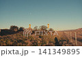 Person's shadow moving along desert roadside at sunset 141349895