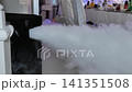 Fog machine emitting heavy smoke creating special effects at a party 141351508