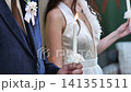 Couple holding lit candles during wedding ceremony symbolizing love and unity 141351511