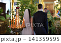 Orthodox wedding ceremony with a bride and groom during a religious ritual 141359595