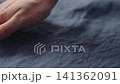 Slow motion man hand checking blue linen shirt cloth 141362091