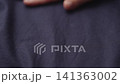 Slow motion man hand checking blue cotton shirt cloth 141363002
