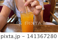 Tropical Fruit Juice with Cocktail Stirrer in Phuket Cafe 141367280