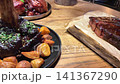 Juicy Grilled Meat Platter With Herbs and Lime Slices 141367290