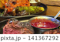 Succulent Grilled Steak with Cherry Tomatoes and Herbs on Plate 141367292