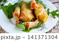 Traditional Korean marinated cabbage rolls with carrot and herbs 141371304