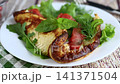 Gourmet omelet with smoked salmon served on wooden table 141371504