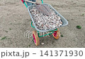 Wheelbarrow loaded with gravel moving to construction site home diy 141371930