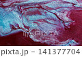 Spill wave. Color stream. Defocused blue red bright paint liquid particles sparkling splash floating on abstract acrylic background. 141377704