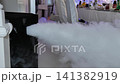 Fog machine emitting heavy smoke creating special effects at a party 141382919