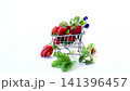 Fresh strawberries in miniature shopping cart isolated on white background 141396457