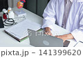 Male doctor cardiologist conducting remote heart health consultation using laptop computer. Concept for telehealth or telemedicine. 141399620