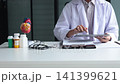 Cardiologist conducting remote heart health consultation using digital tablet. Concept for telehealth or telemedicine. 141399621