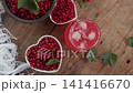 Fresh Red Currants in Heart Shaped Bowl Beside Drink Jug 141416670