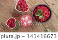 Close-Up of Iced Red Currant Drink Surrounded by Fresh Berries 141416673