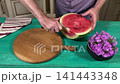 A mam is tasting food at home kitchen 141443348