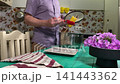 A mam is tasting food at home kitchen 141443362