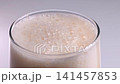 Enjoying beer with foam on top during a warm day 141457853