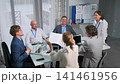 teamwork brainstorming session, experts analyze reports and brainstorm strategies in professional setting, dedicated team of professionals collaboratively planning and analyzing data during focused 141461956
