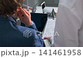 Assistant asking for urgent document approval during business meeting 141461958