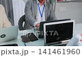 Stressed business team rushing to meet deadline in office 141461960
