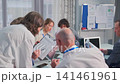 Business team collaborating during office meeting with documents 141461961