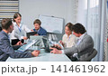 Team analyzing project data during office meeting 141461962
