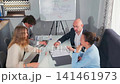 Business team analyzing documents and strategy during office meeting 141461973