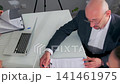 Business partners signing contract during office meeting 141461975