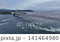 鳴門海峡に朝日が昇る鳴門大橋と迫力ある渦潮のドローン空撮写真（徳島県） 141464980