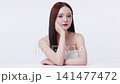 Beautiful young Asian woman with K beauty style makeup and perfect skin. Facial and skin care concept for commercial advertising. 141477472
