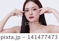 Beautiful young Asian woman with K beauty style makeup and perfect skin. Facial and skin care concept for commercial advertising. 141477473