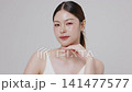 Slow motion of beautiful young Asian girl with k-beauty make up style on isolated white background for commercial beauty advertising. 141477577