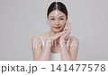 Slow motion of beautiful young Asian girl with k-beauty make up style on isolated white background for commercial beauty advertising. 141477578