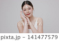 Slow motion of beautiful young Asian girl with k-beauty make up style on isolated white background for commercial beauty advertising. 141477579