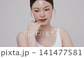 Slow motion of beautiful young Asian girl with k-beauty make up style on isolated white background for commercial beauty advertising. 141477581