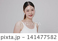 Slow motion of beautiful young Asian girl with k-beauty make up style on isolated white background for commercial beauty advertising. 141477582