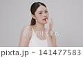 Slow motion of beautiful young Asian girl with k-beauty make up style on isolated white background for commercial beauty advertising. 141477583
