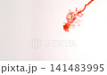Abstract close-up of blood dissolving and dispersing in water, creating dynamic red swirls and fluid patterns, isolated on a white background, slow motion 141483995