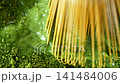 Bamboo Whisk Chasen Mixing Matcha Tea in Macro Close Up 141484006