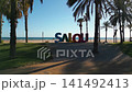 colorful letters of Salou town, palm trees andl beach at sunset, Catalonia, Spain 4k 141492413