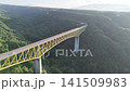 清里高原に架かる黄色の八ヶ岳大橋と朝日を捉えたドローン空撮（山梨県北杜市） 141509983