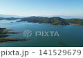 Aerial drone view of emerald Lake Plastiras surrounded by pine tree forest and Agrafa mountains in Thessaly Greece for European nature travel video background. High quality 4k footage 141529679
