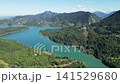 Aerial drone view of emerald Lake Plastiras surrounded by pine tree forest and Agrafa mountains in Thessaly Greece for European nature travel video background. High quality 4k footage 141529680