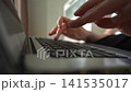 Close-up of woman hands typing on laptop keyboard. Female freelancer working, studying, browsing internet. Modern business, communication, technology concept. Shooting in slow motion. 141535017
