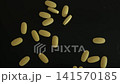 Yellow Vitamin Tablets Pouring From Bottle 141570185