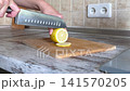 Slicing Fresh Yellow Lemon Close Up 141570205