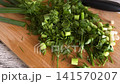 Fresh Green Herbs on Cutting Board 141570207
