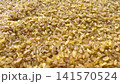 Macro panning video shot of raw organic bulgur wheat groats. Perfect for healthy eating, agricultural, and culinary projects. 141570524