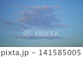 Clouds Drifting Across Calm Blue Sky 141585005